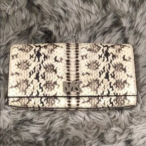 Brand new, never used Michael Kors Mott clutch